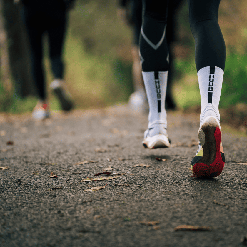 runners on a leafy trail